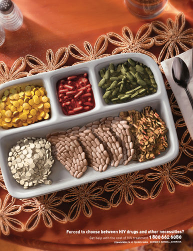 Various pills fill the spaces of a TV dinner tray in the shape of food items