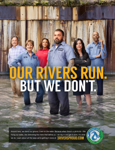 A group of proud Alcosan employees stand knee-deep in a river,Advertising Photographers