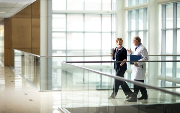 Doctors talking while walking